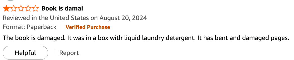 One-star review stating book arrived damaged from liquid laundry detergent, with bent pages, verified purchase in US on Aug 20, 2024